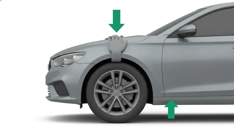 Push down firmly on each corner — press on the body directly above the wheel, not the middle of a panel — and watch it settle